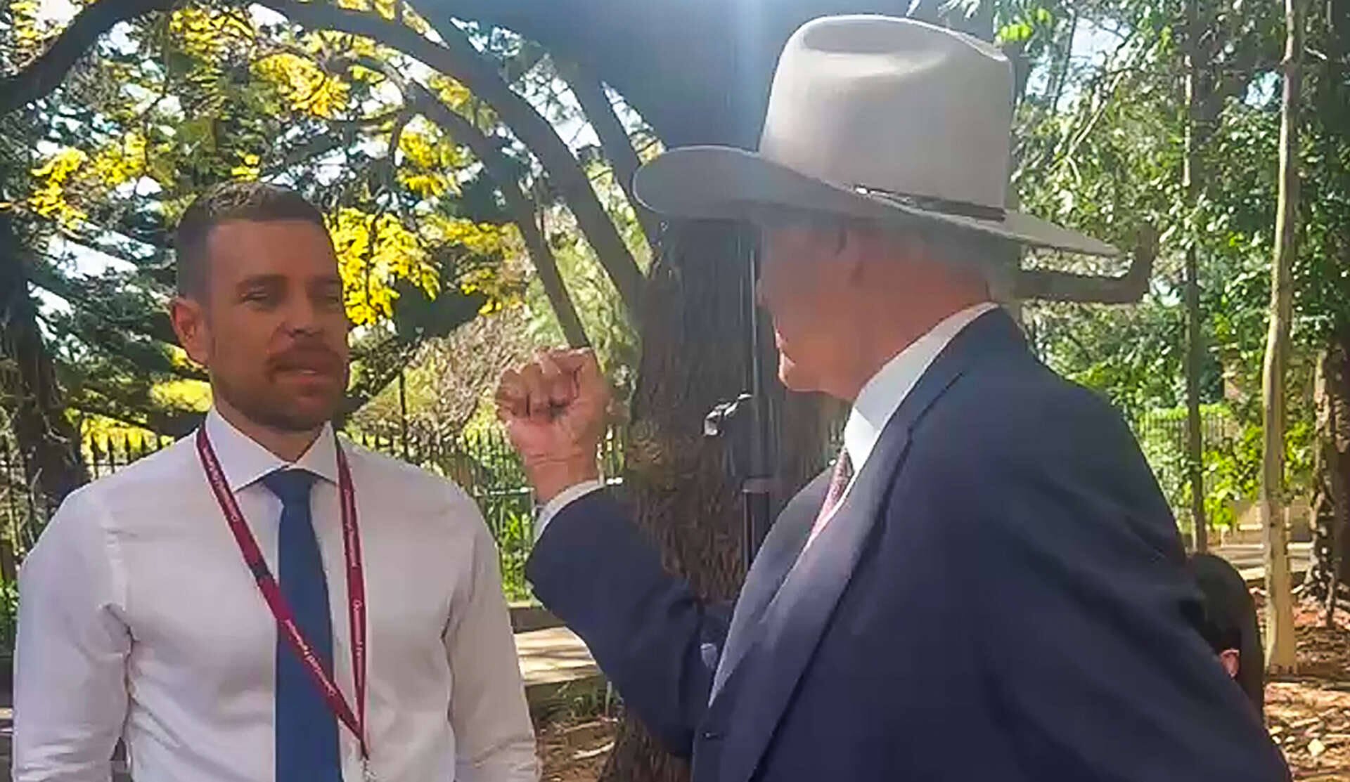 ‘You’re a racist’: Veteran MP raises fist at Greek Australian reporter