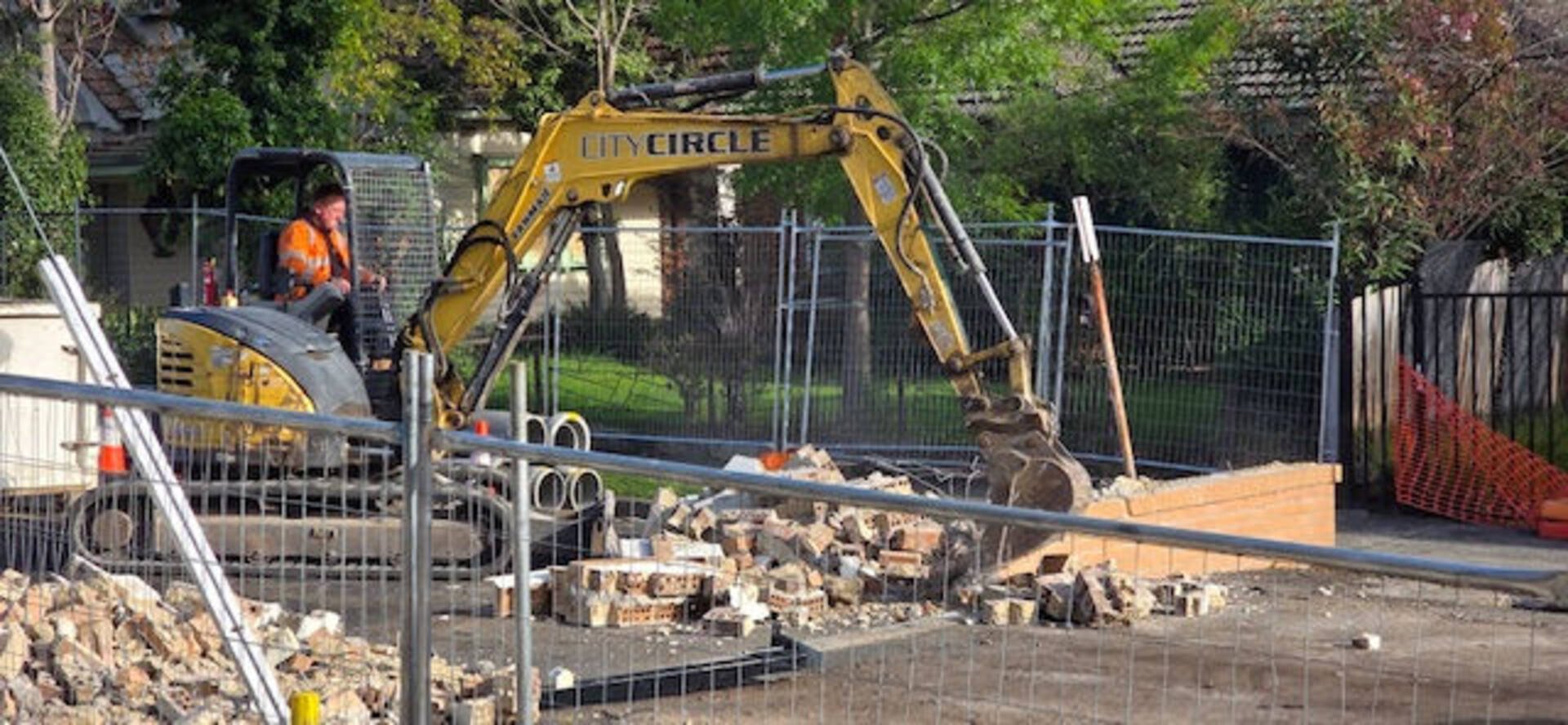 Council demolishes Alphington Grammar gates, school vows to fight on